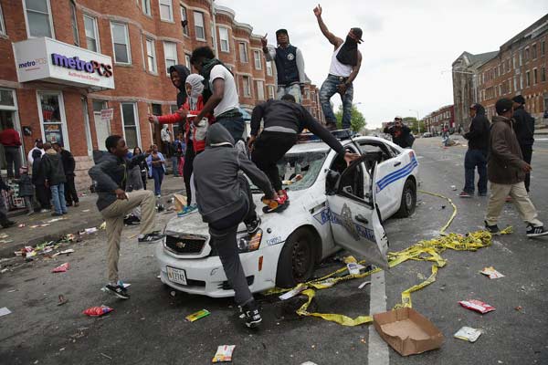 Riot, looting prompt state of emergency, curfew in Baltimore