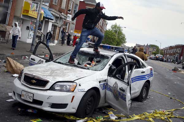 Riot, looting prompt state of emergency, curfew in Baltimore