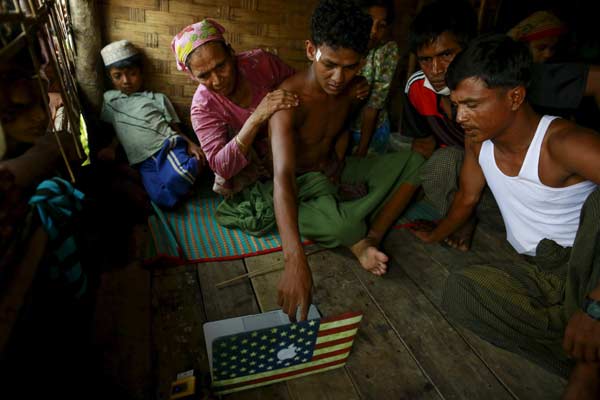 Migrant boat still being held off Myanmar coast