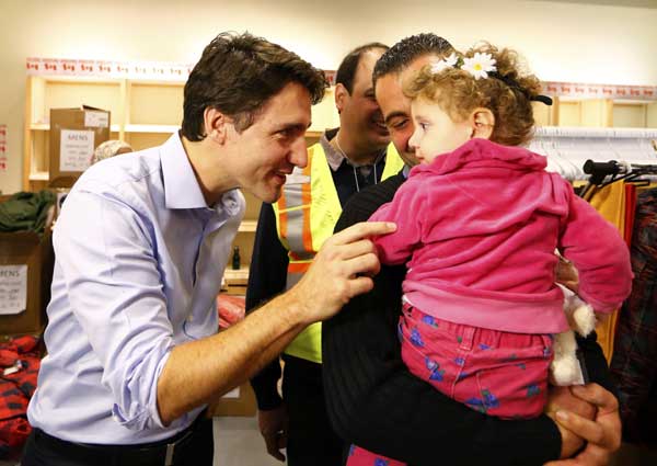 First planeload of Syrian refugees arrives in Canada