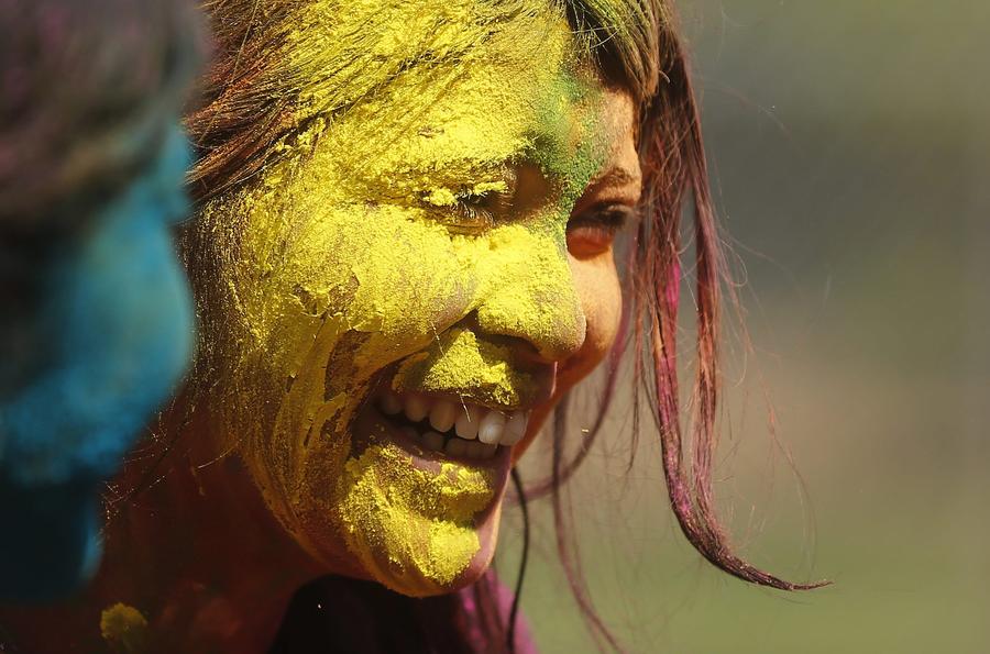 Dancing in bright colors of Holi