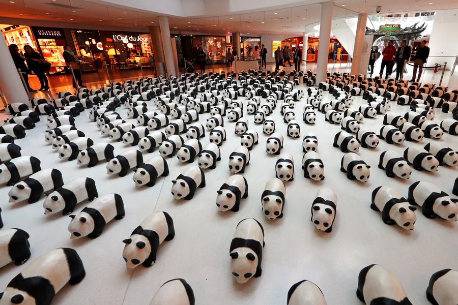 1,600 papier-mache pandas land in Paris