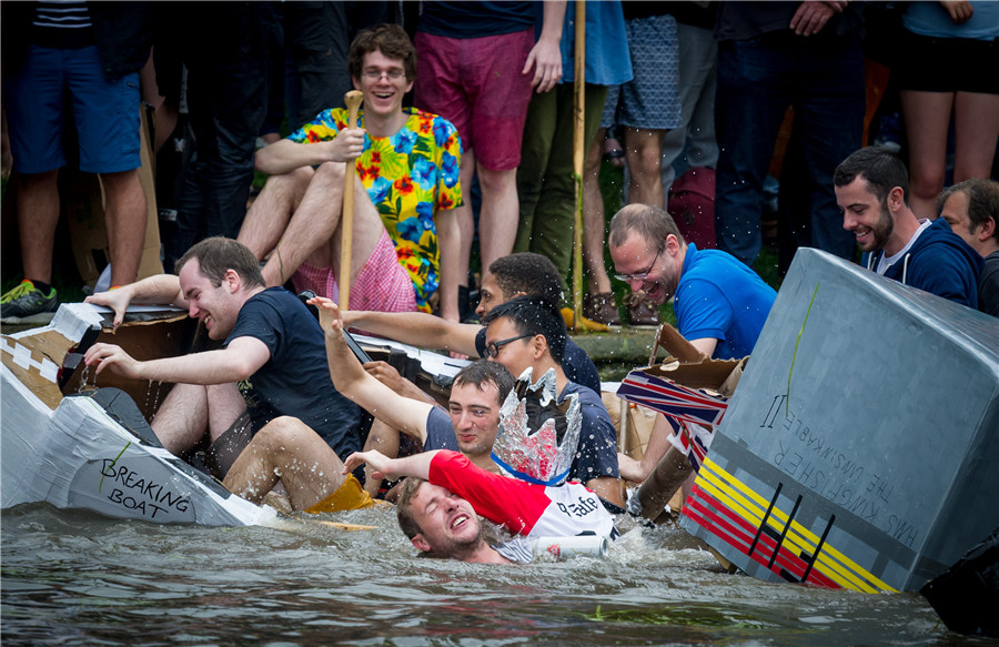 Cambridge students celebrate end of exams with cardboard boat race