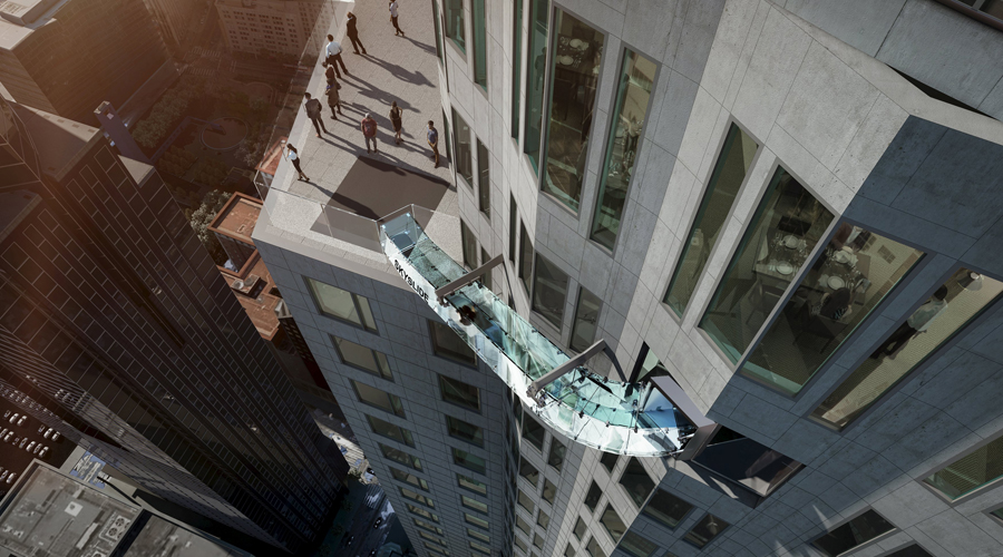 Woman rides skyslide 1000-feet above downtown Los Angeles