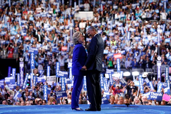 Obama urges Americans to get behind Clinton, slams Trump