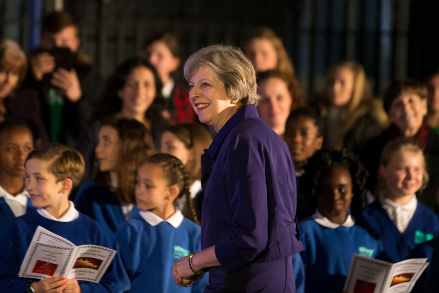 British PM lights Downing Street Christmas tree with local children