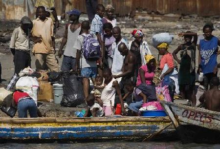 Haitians flee homeland by boat as in movie '2012'