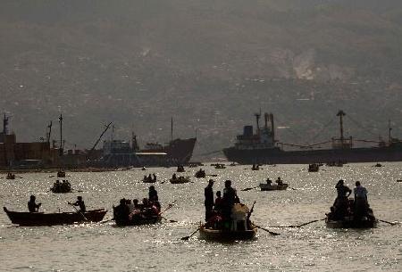 Haitians flee homeland by boat as in movie '2012'